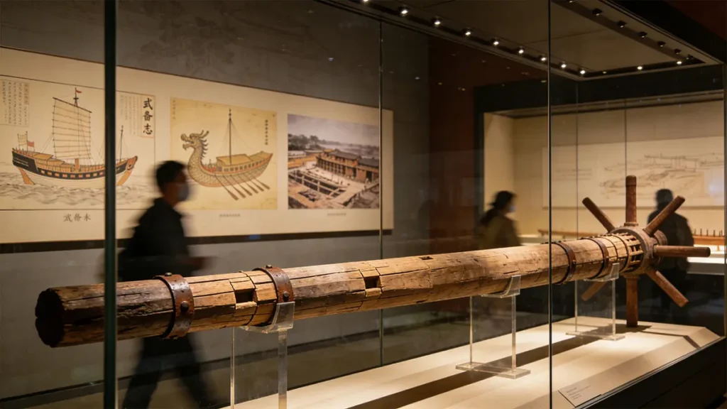The 11.07-meter-long rudder post from a Ming treasure ship, excavated in 1957 at Longjiang Shipyard, now housed in Nanjing Museum.